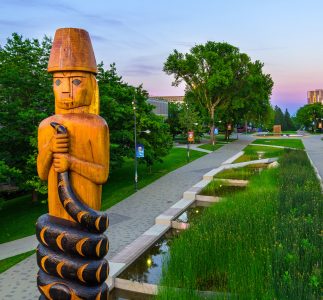 aerial view of ubc campus focusing on a carved Musqueam post